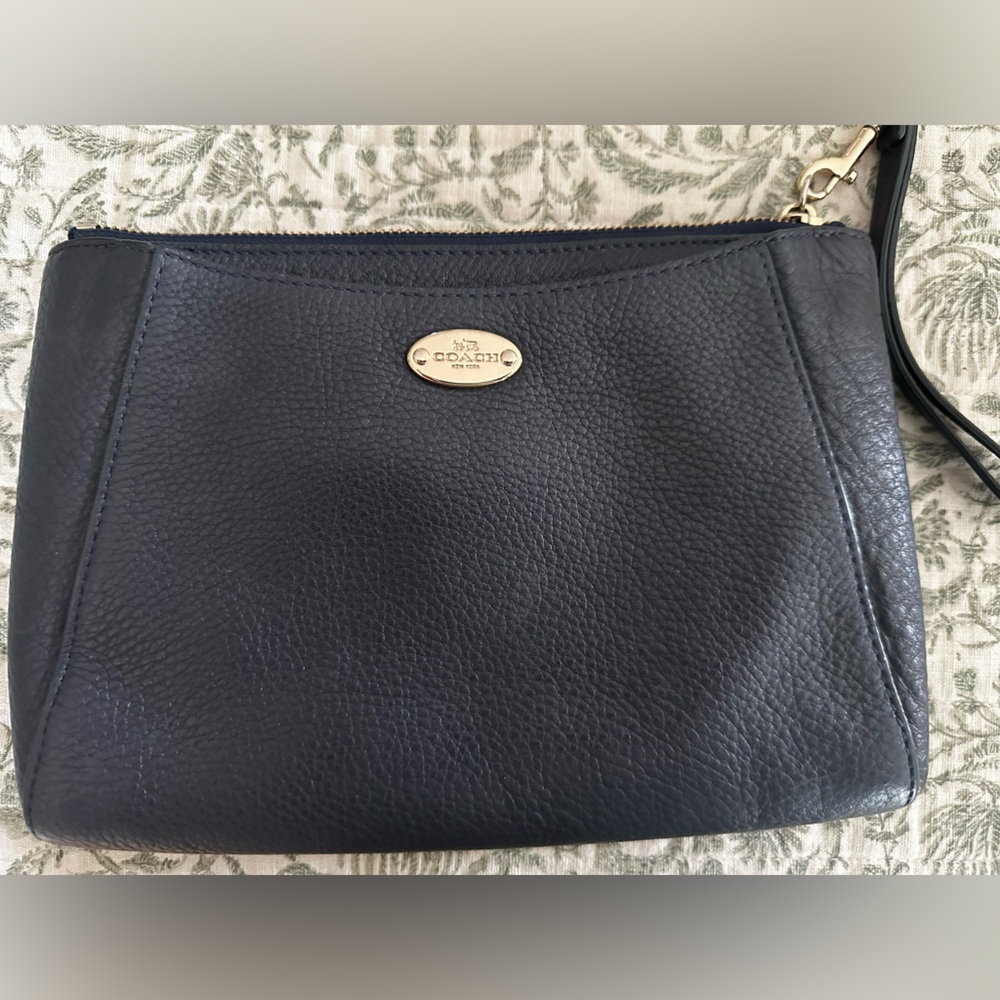 Navy blue Coach clutch purse.